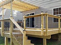 <b>Wood deck and steps with wood railing and pergola</b>